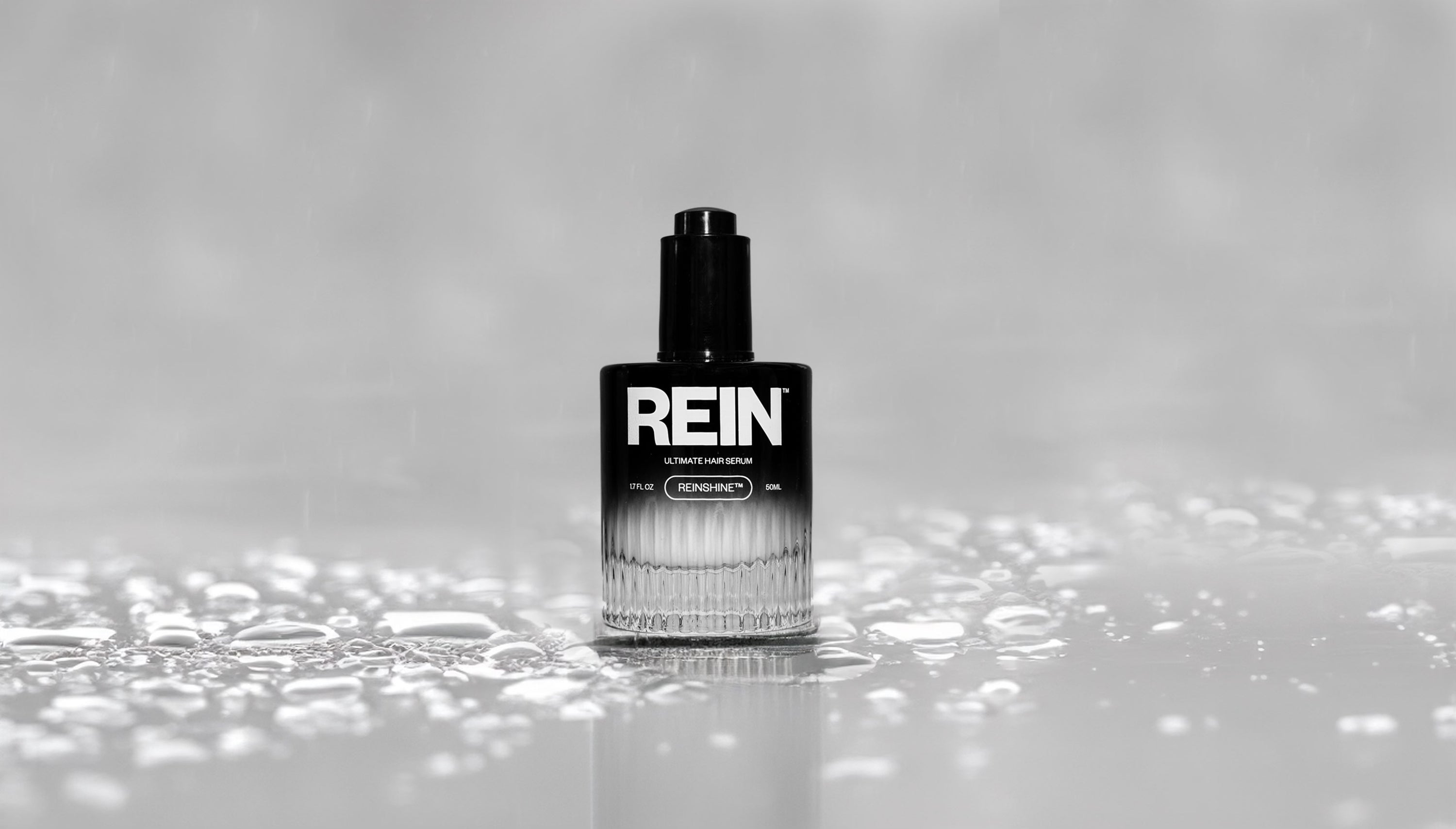 REIN Ultimate Hair Serum Water Droplets White Back Ground